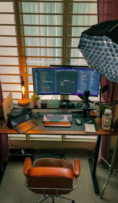 A contemporary workspace showcasing a laptop, tablet, and smartphones, ideal for tech and freelance use.